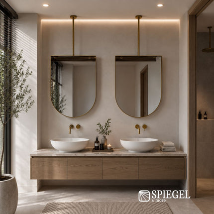 Gold Celeste arched suspended mirror above double vanity